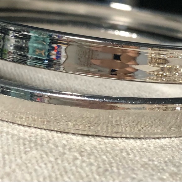 Hoop fashion earrings. Silver color. 4”. Sleek finish - Picture 2 of 3